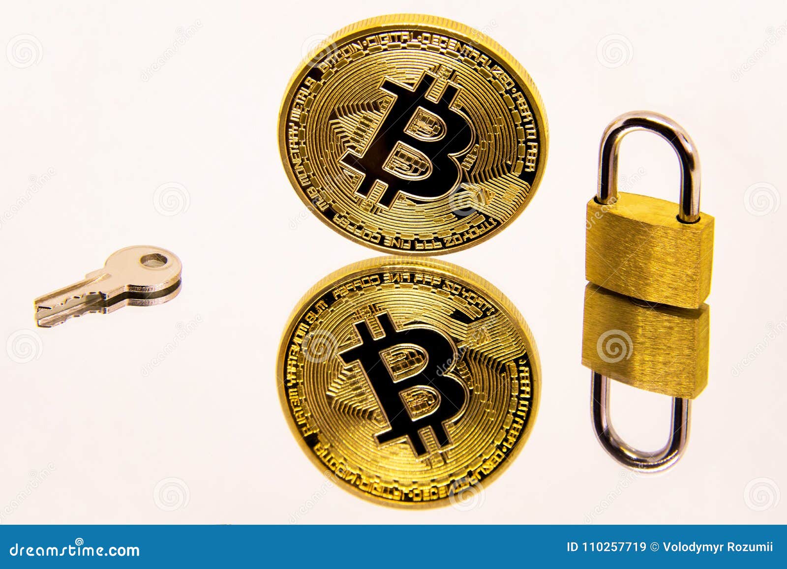 conceptual image of a cryptocurrency bitcoin coin on a white mirror surface with a golden padlock and key