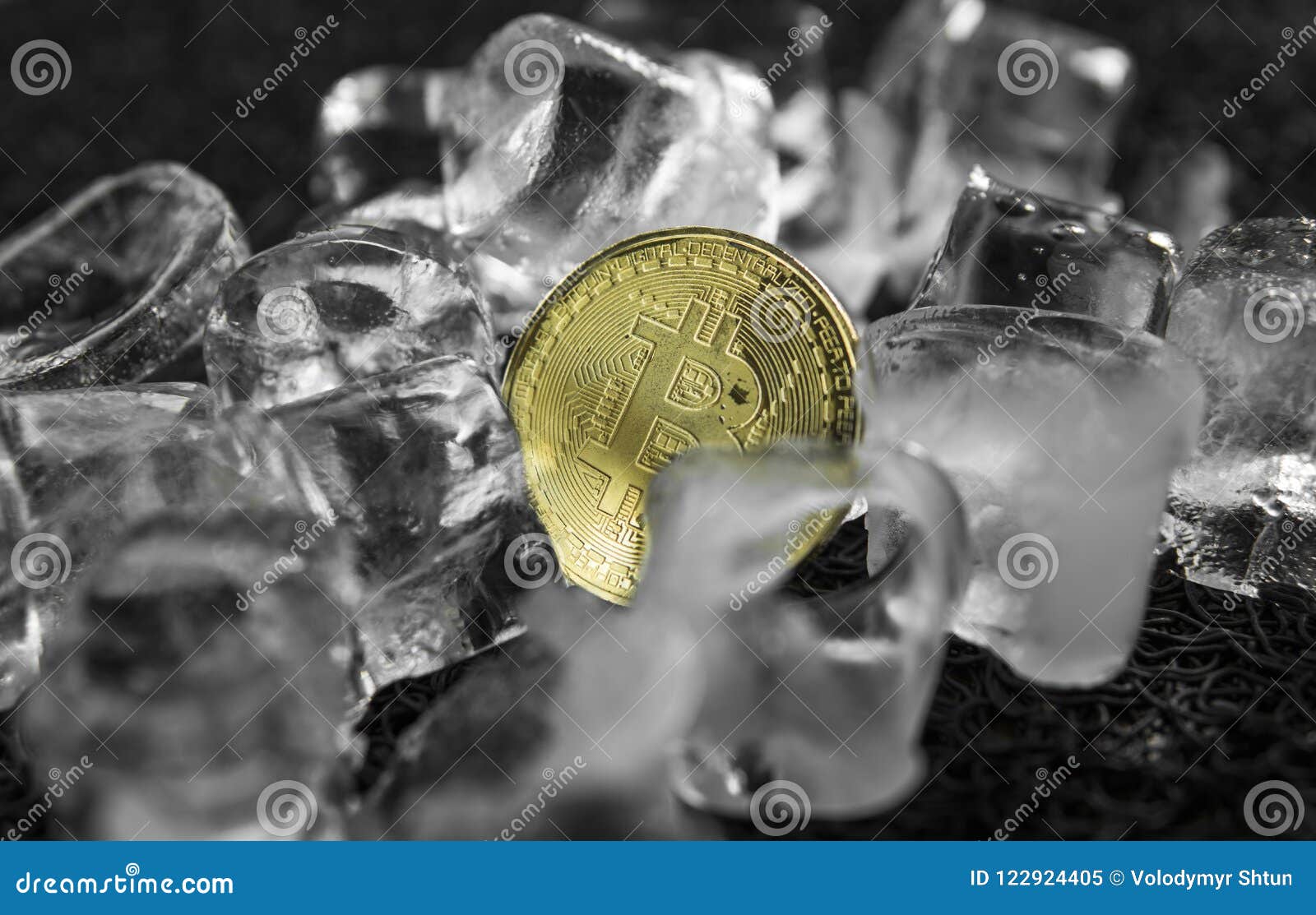 Gold Bitcoin On Ice Background. The Concept Of The ...