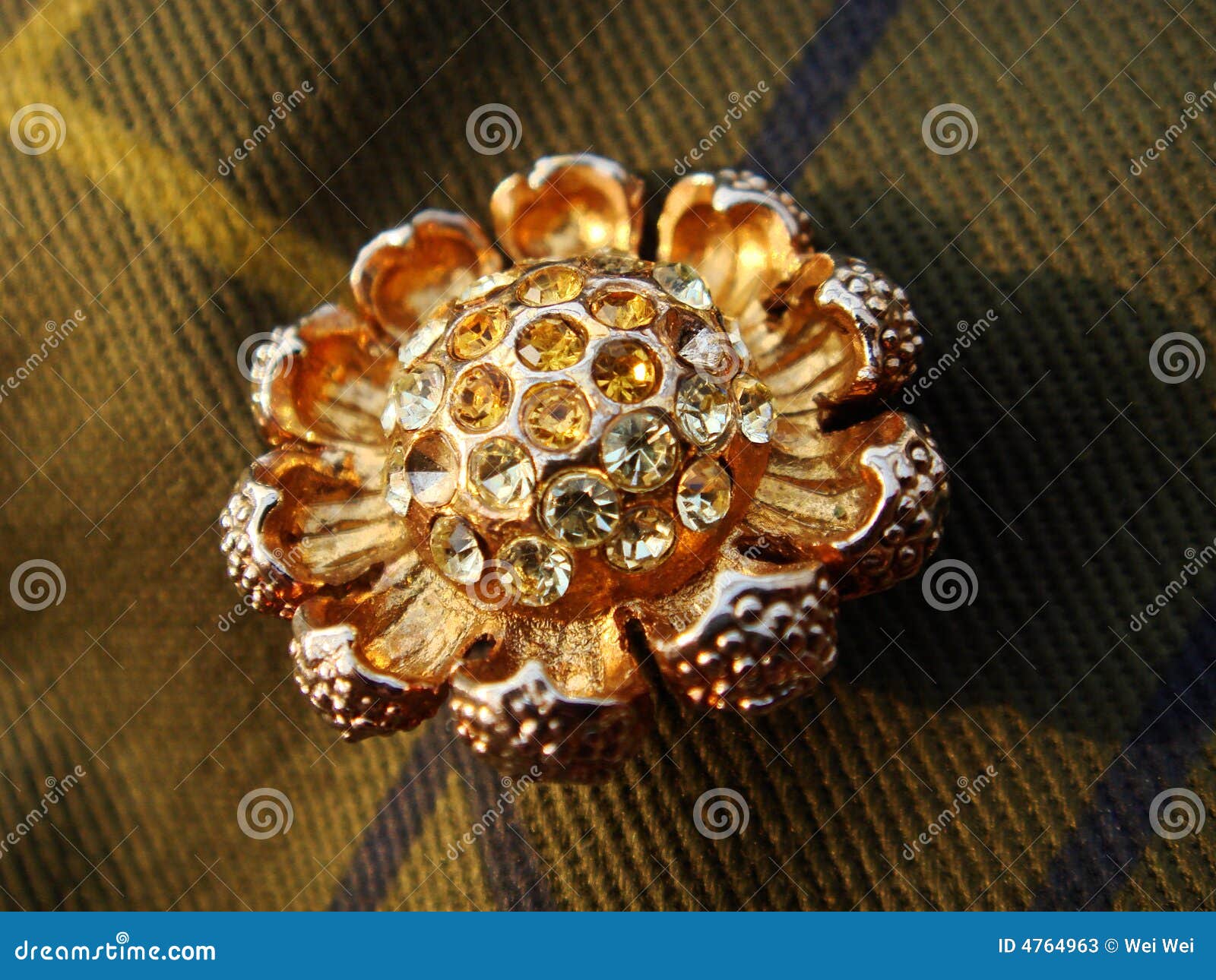 gold brooch with rhinestones