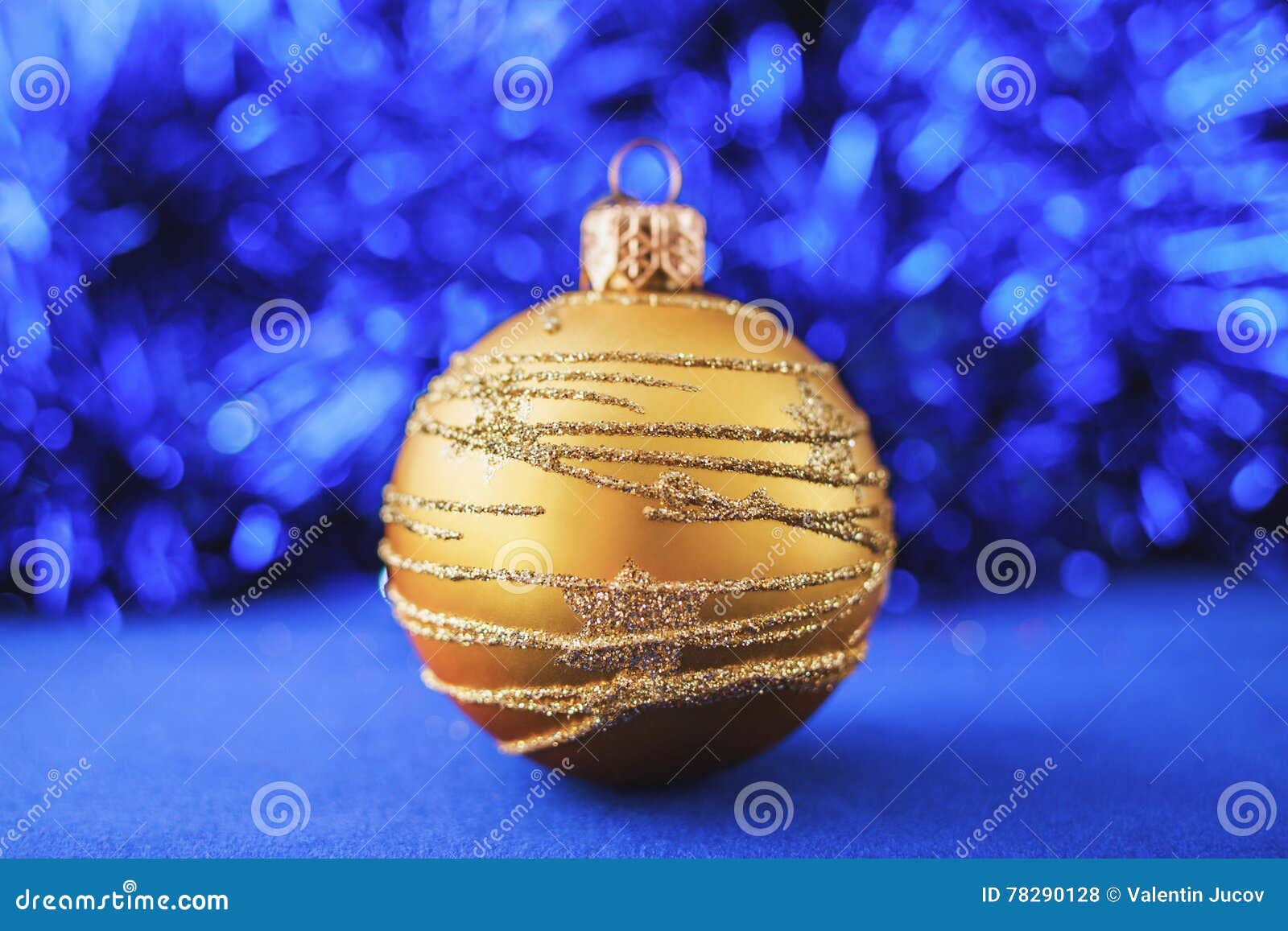 Gold Christmas Ornament on Blue Holiday Background. Xmas and New Year ...