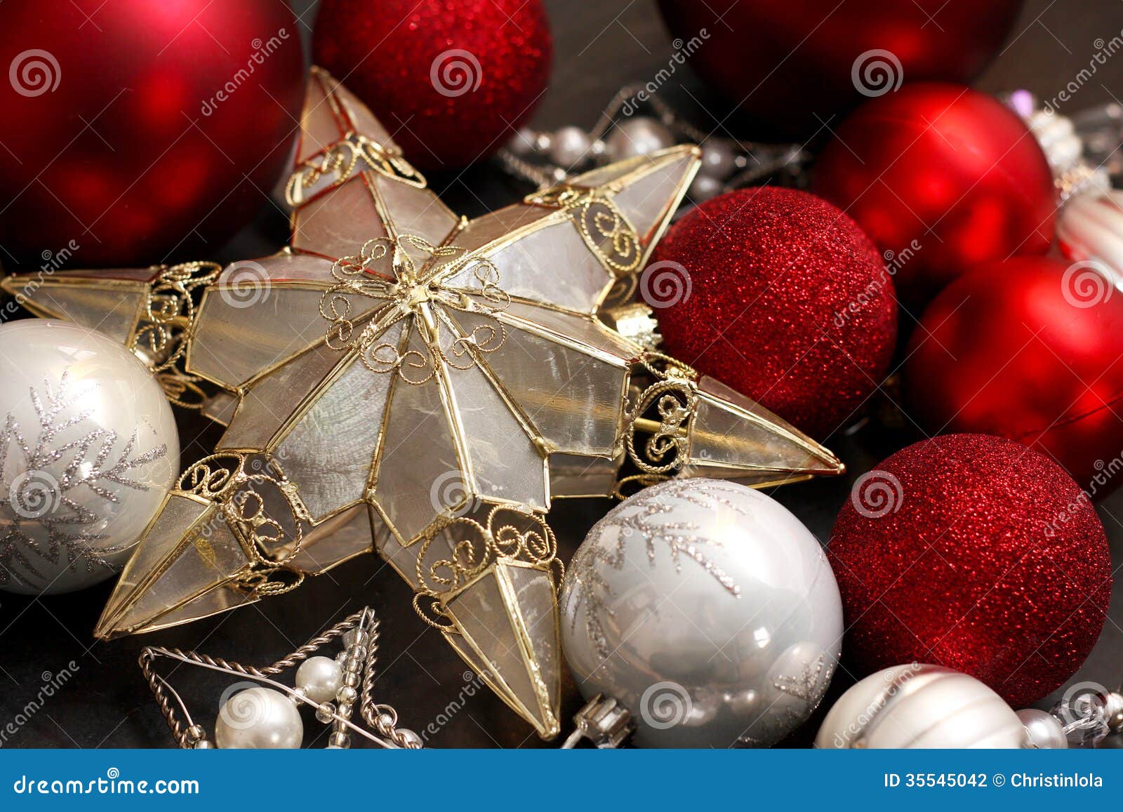 Gold Christmas Tree Star And Red Bulbs Stock Photo - Image of sparkles, season: 35545042