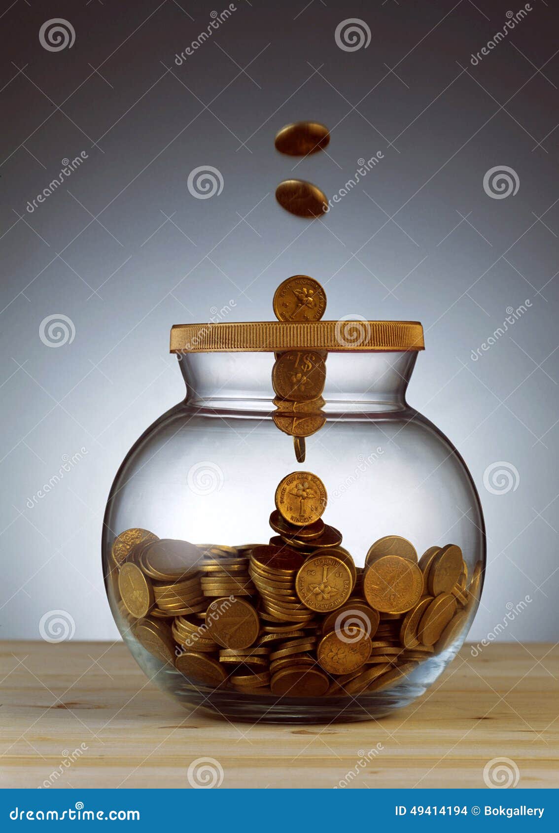 Gold Coins Dropping into Glass Jar Stock Photo Image of living