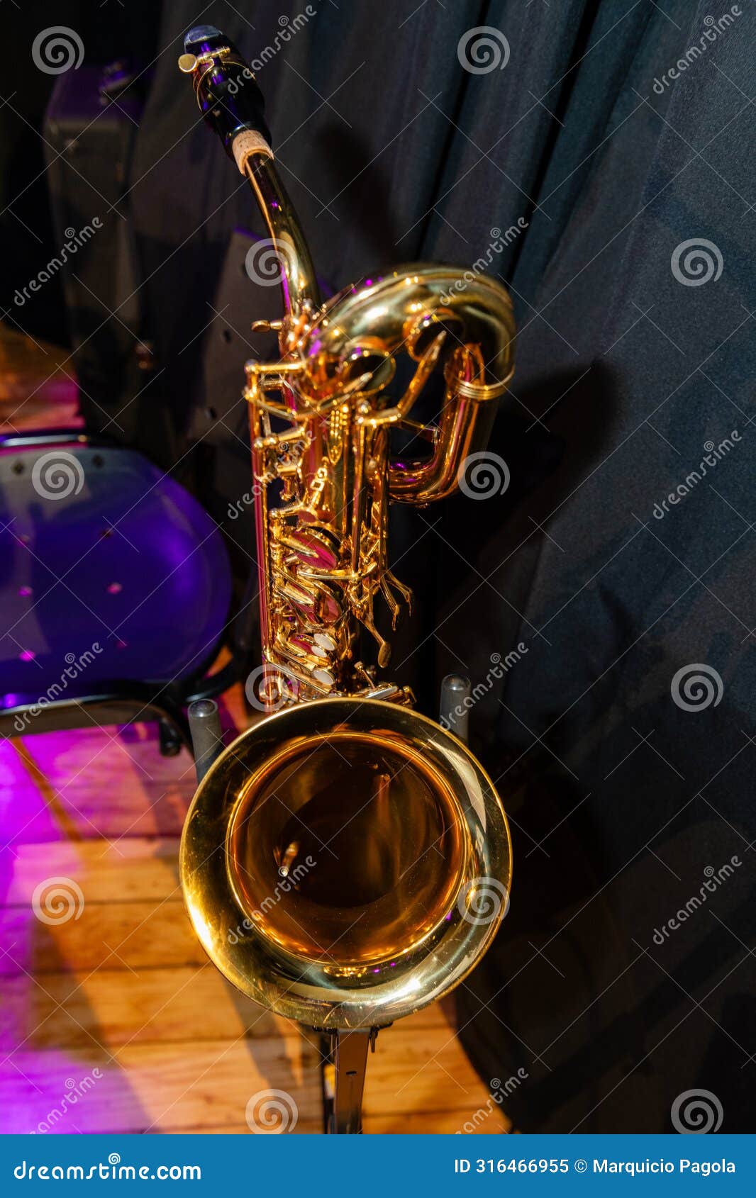 a gold colored saxophone is on display