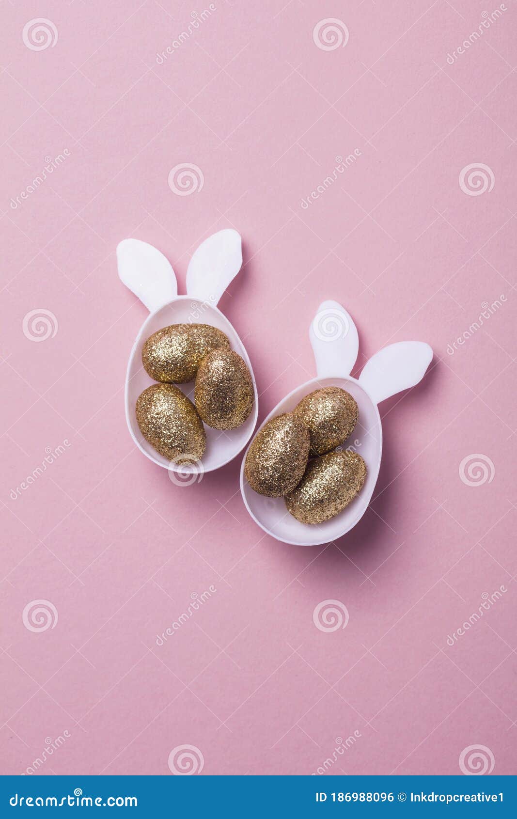 Gold Glitter Eggs in a White Easter Bunny Egg Shape with Ears Stock
