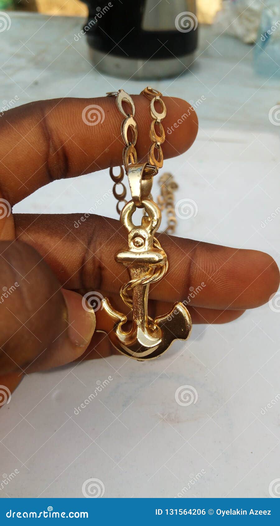 Gold Hook Chain stock photo. Image of hand, chain, held 131564206