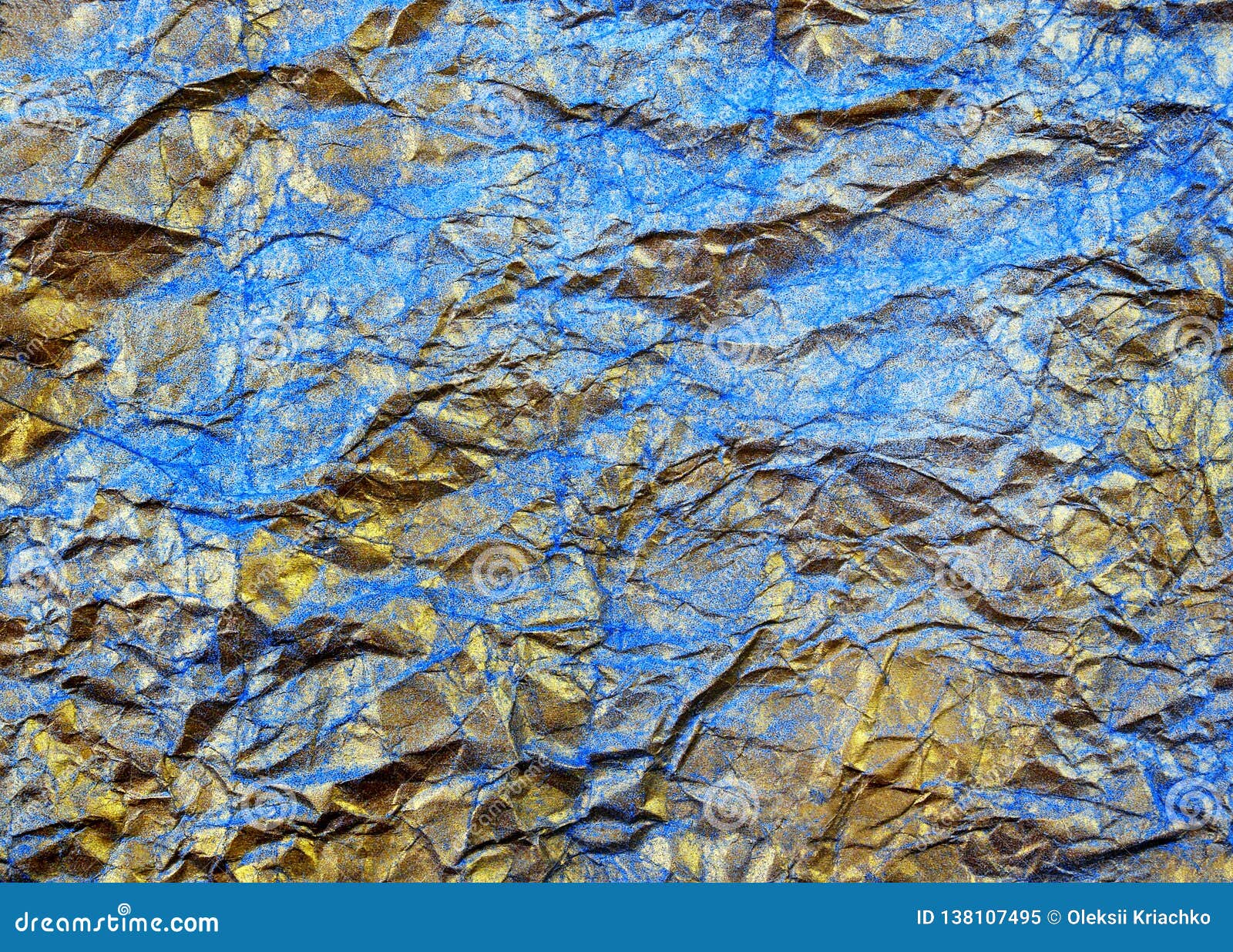 Gold Leaf on a Blue Abstract Background. Fallen Autumn Leaves. Gold on