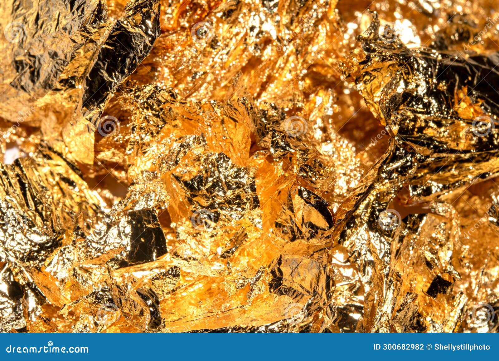 Gold Leaf Pieces Close Up on a White Background As Decorative Pieces