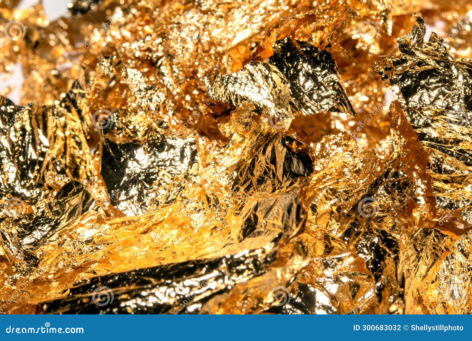 Gold Leaf Pieces Close Up on a White Background As Decorative Pieces