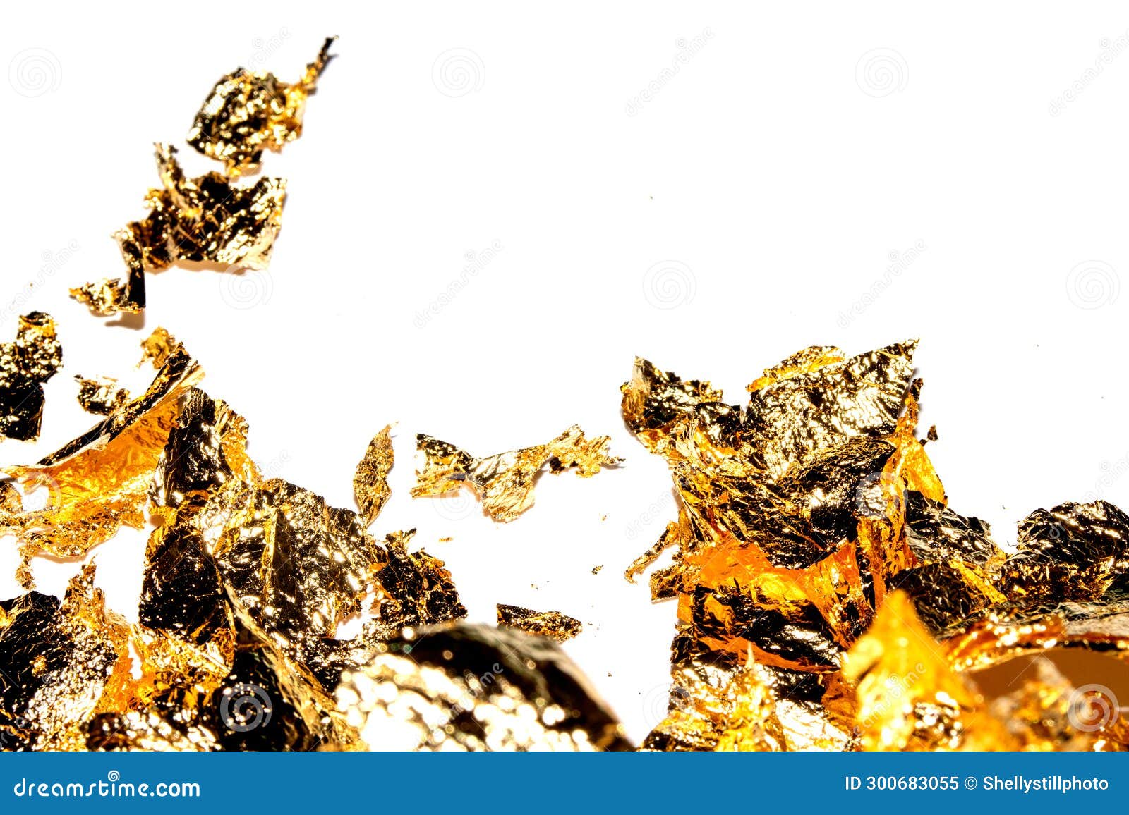 Gold Leaf Pieces Close Up on a White Background As Decorative Pieces