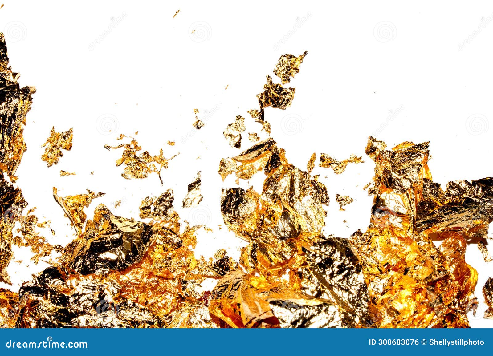 Gold Leaf Pieces Close Up on a White Background As Decorative Pieces