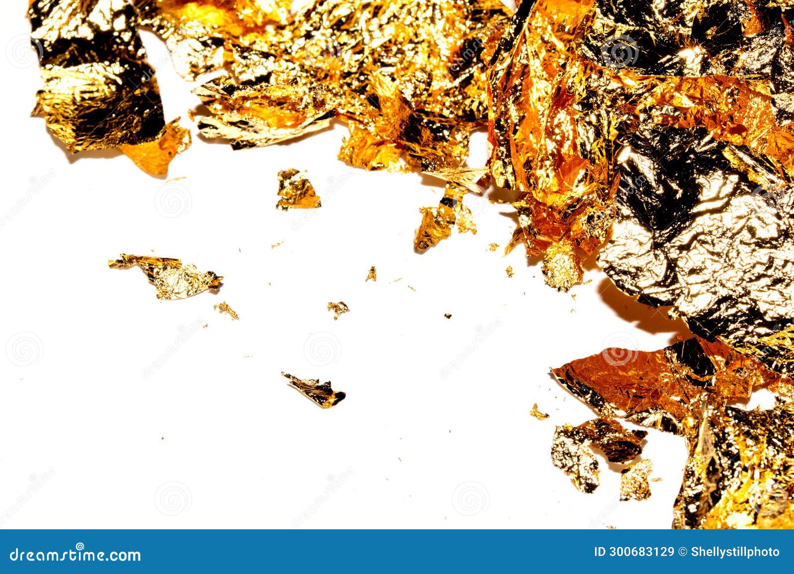 Gold Leaf Pieces Close Up on a White Background As Decorative Pieces