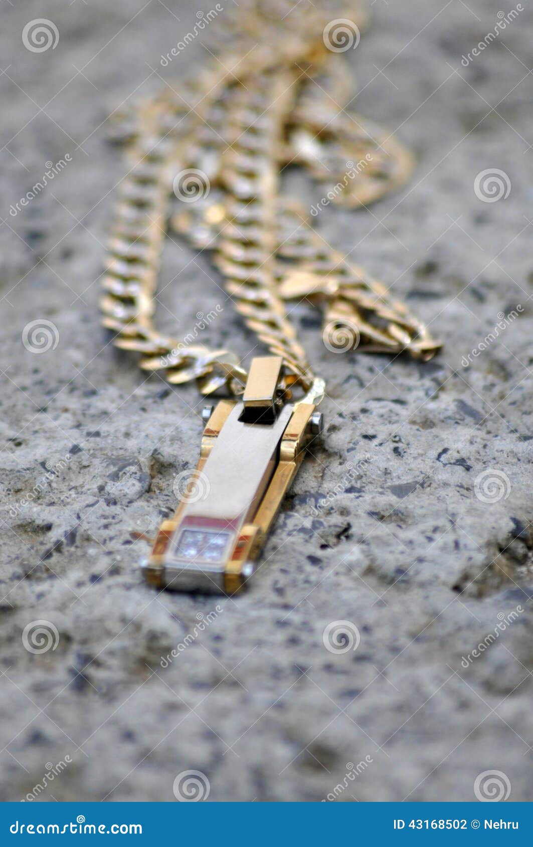 Gold Necklace on a Concrete Stock Photo Image of plated, gold 43168502