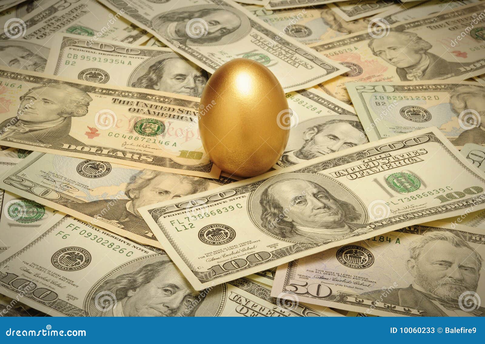 gold nest egg on a layer of cash