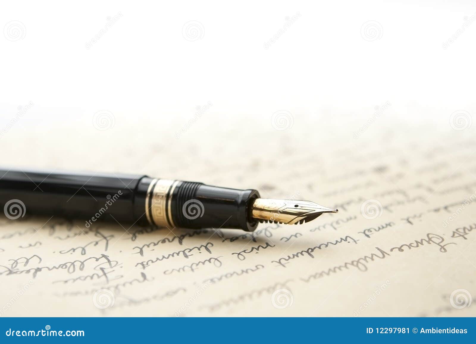 gold pen with letter and writing