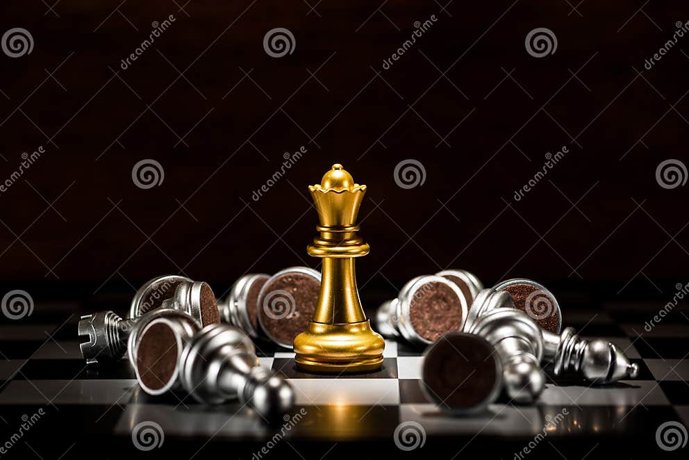 Gold Queen Chess Surrounded by a Number of Fallen Silver Chess P Stock ...