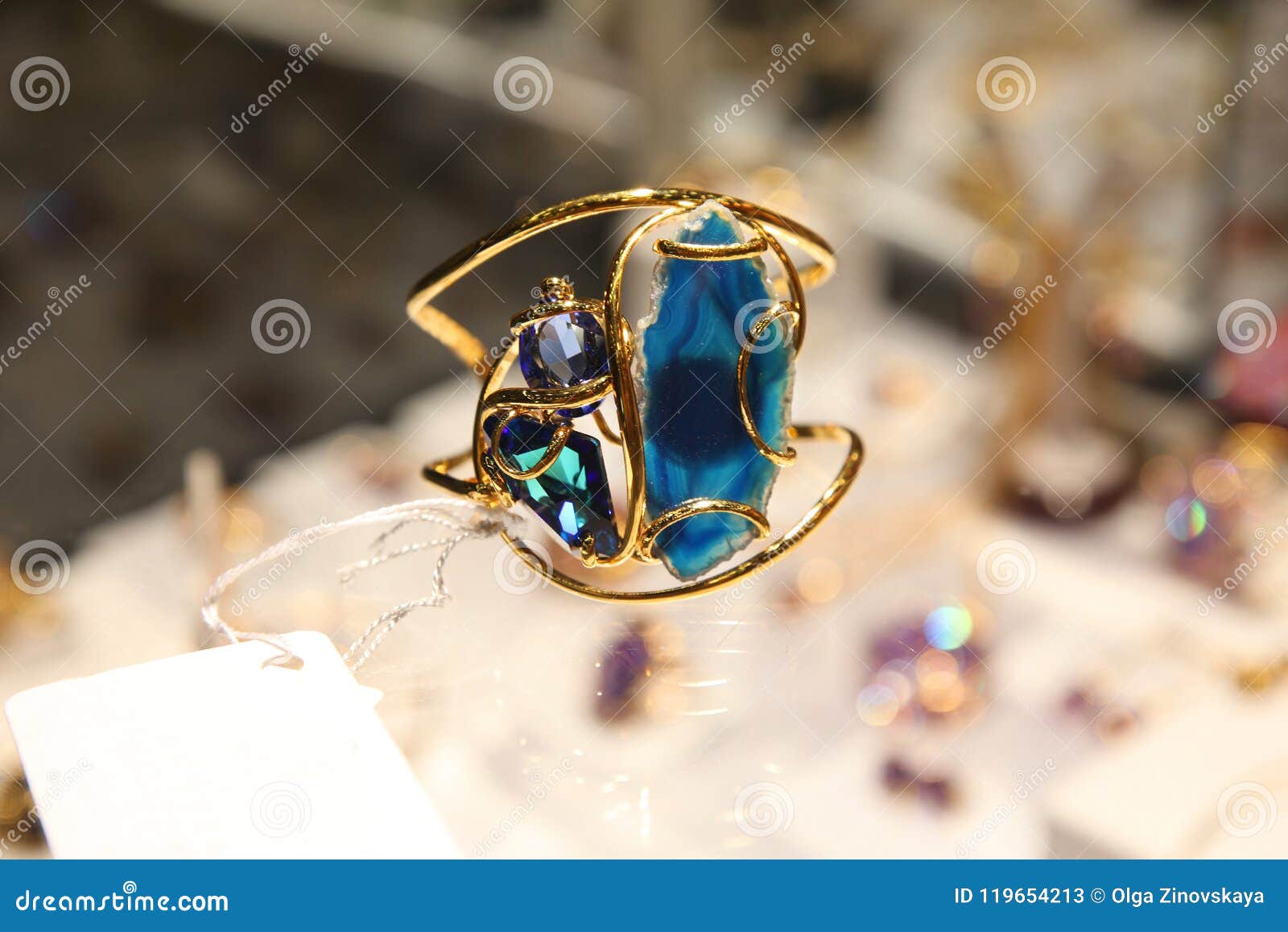 Gold tone blue stone vanki finger ring dj-42454 – dreamjwell