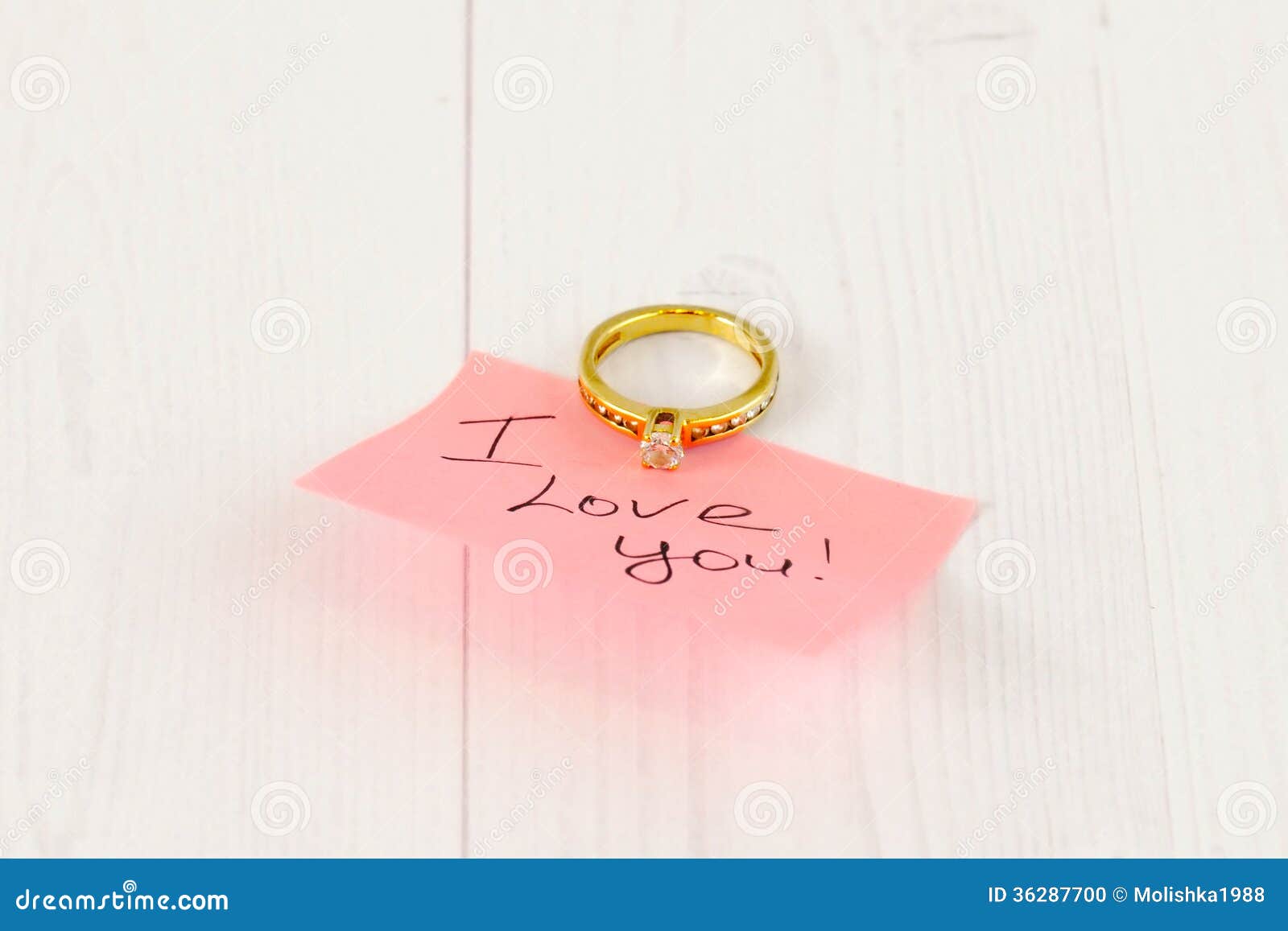 Gold Ring with Pink Sticker on White Wood Stock Photo Image of