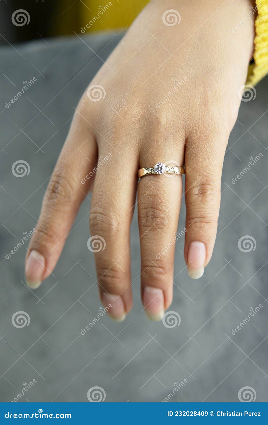 Hand of a Girl with Gold Rings Stock Image - Image of nail, jeans: 52256733