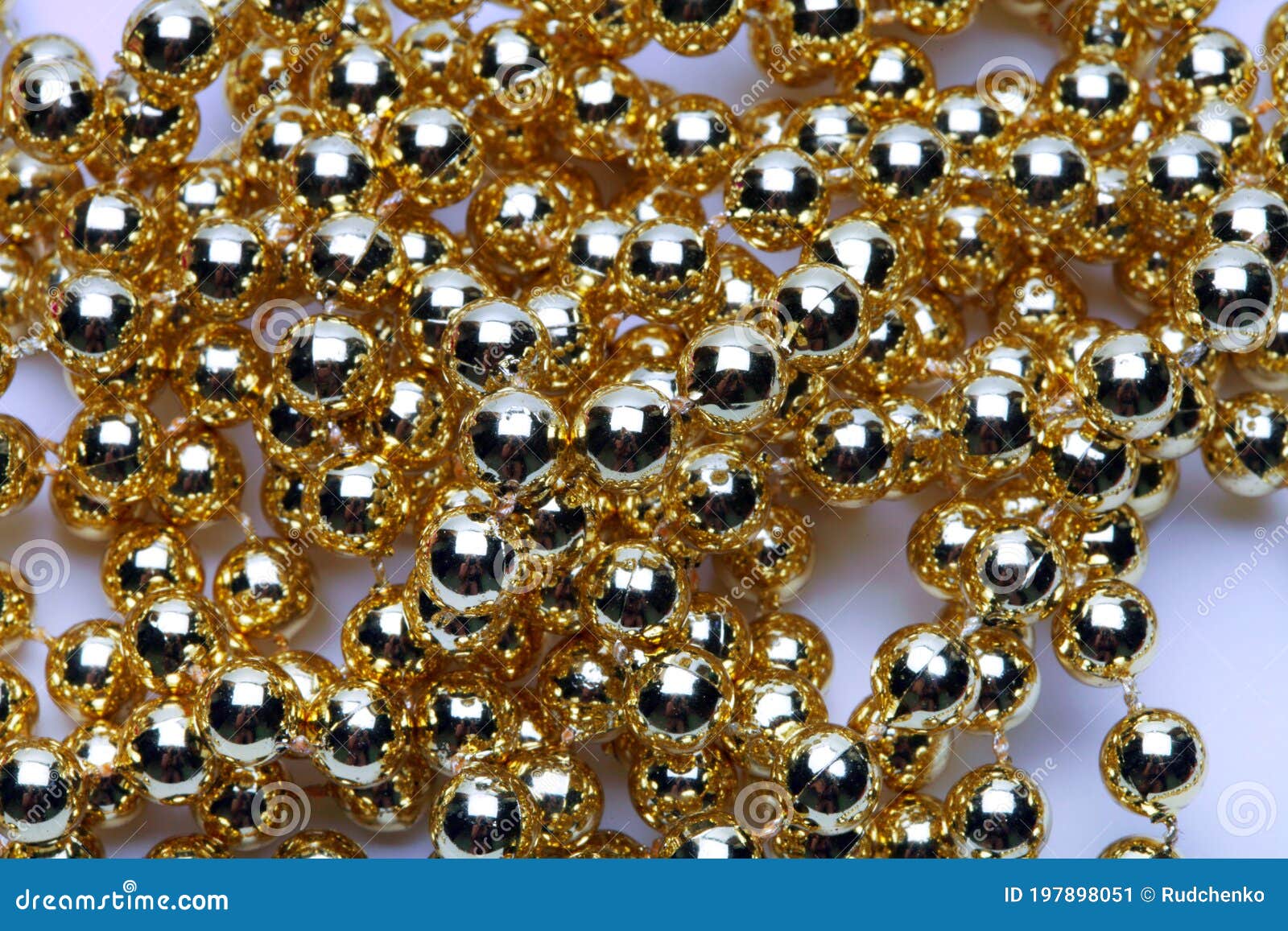 Gold round beads garland stock image. Image of merry 197898051