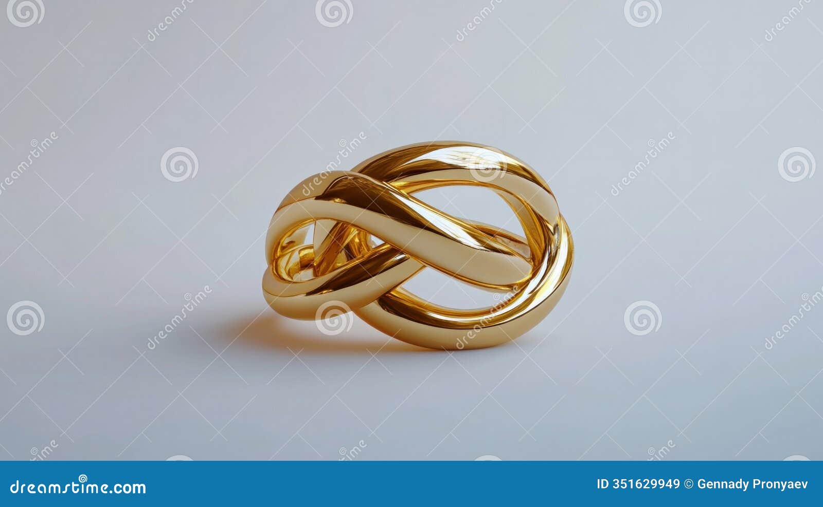 golden knot sculpture on soft grey background displaying artistic elegance