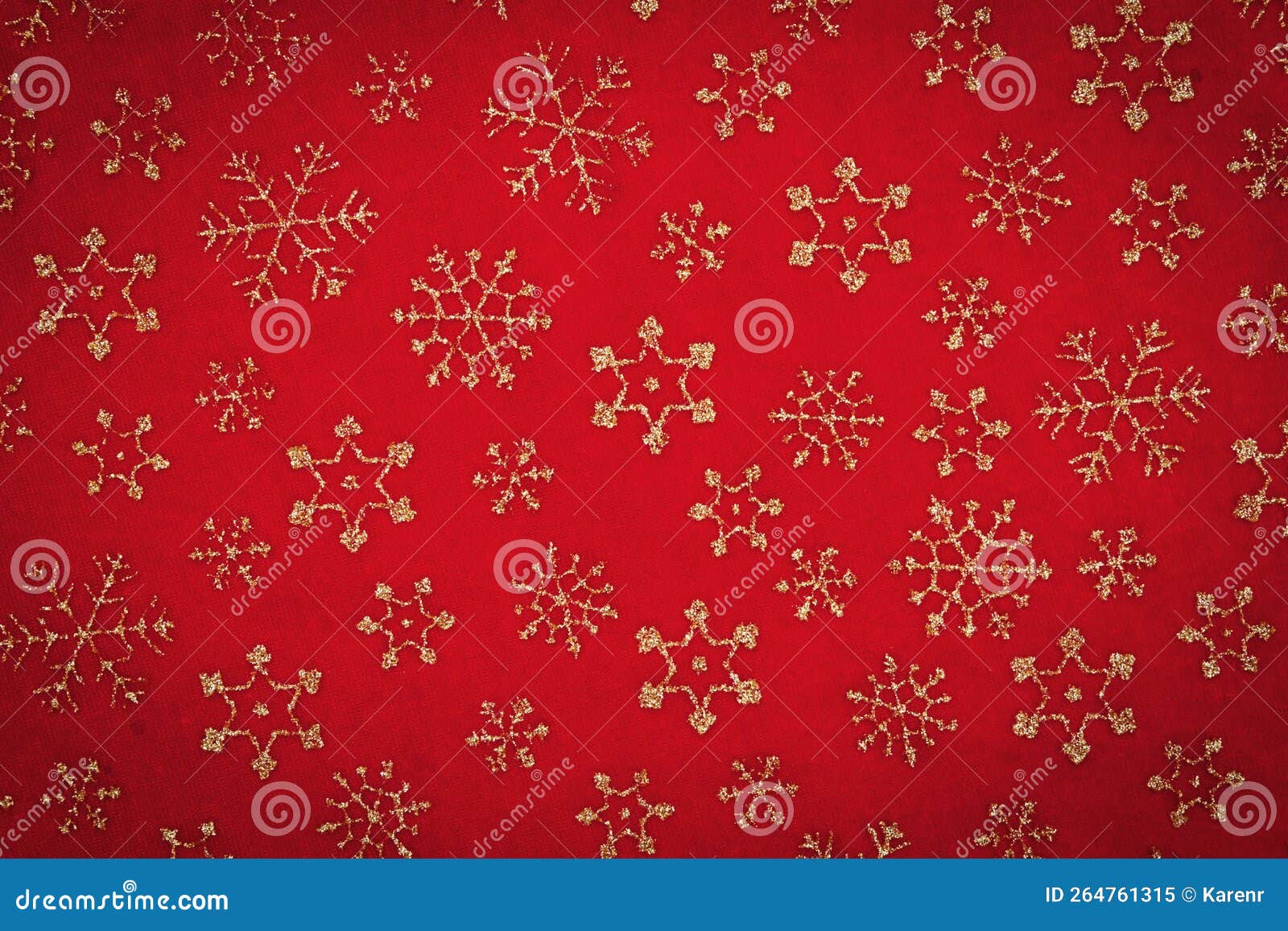 gold snowflakes on red material holiday background