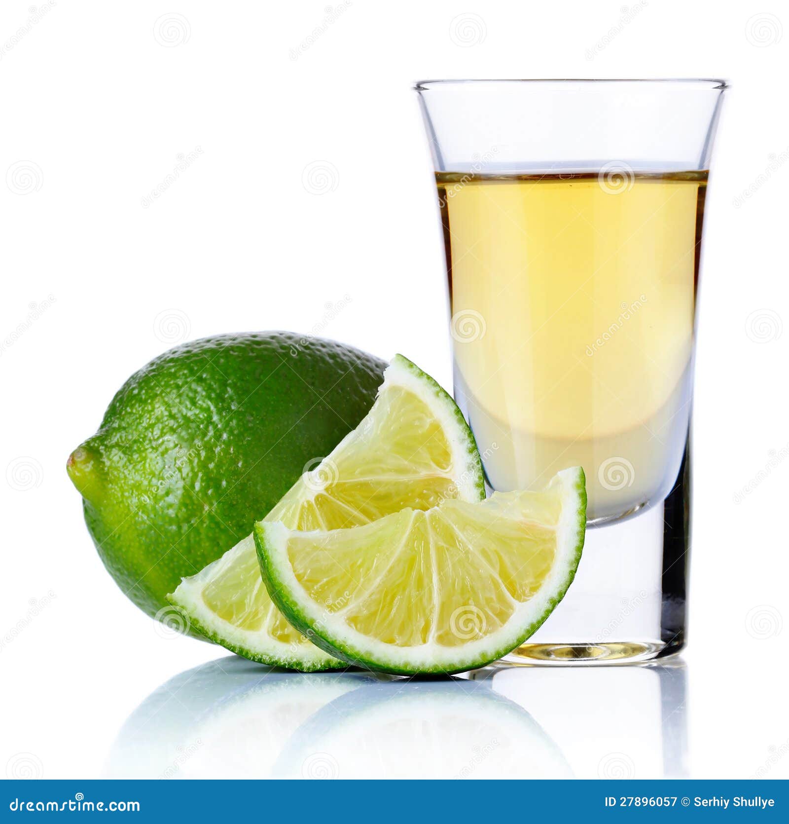 gold tequila shot with lime  on white