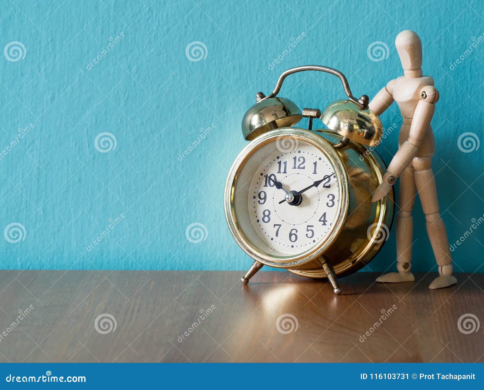 Gold Vintage Alarm Clock On The Wood Table In The Font Of ...