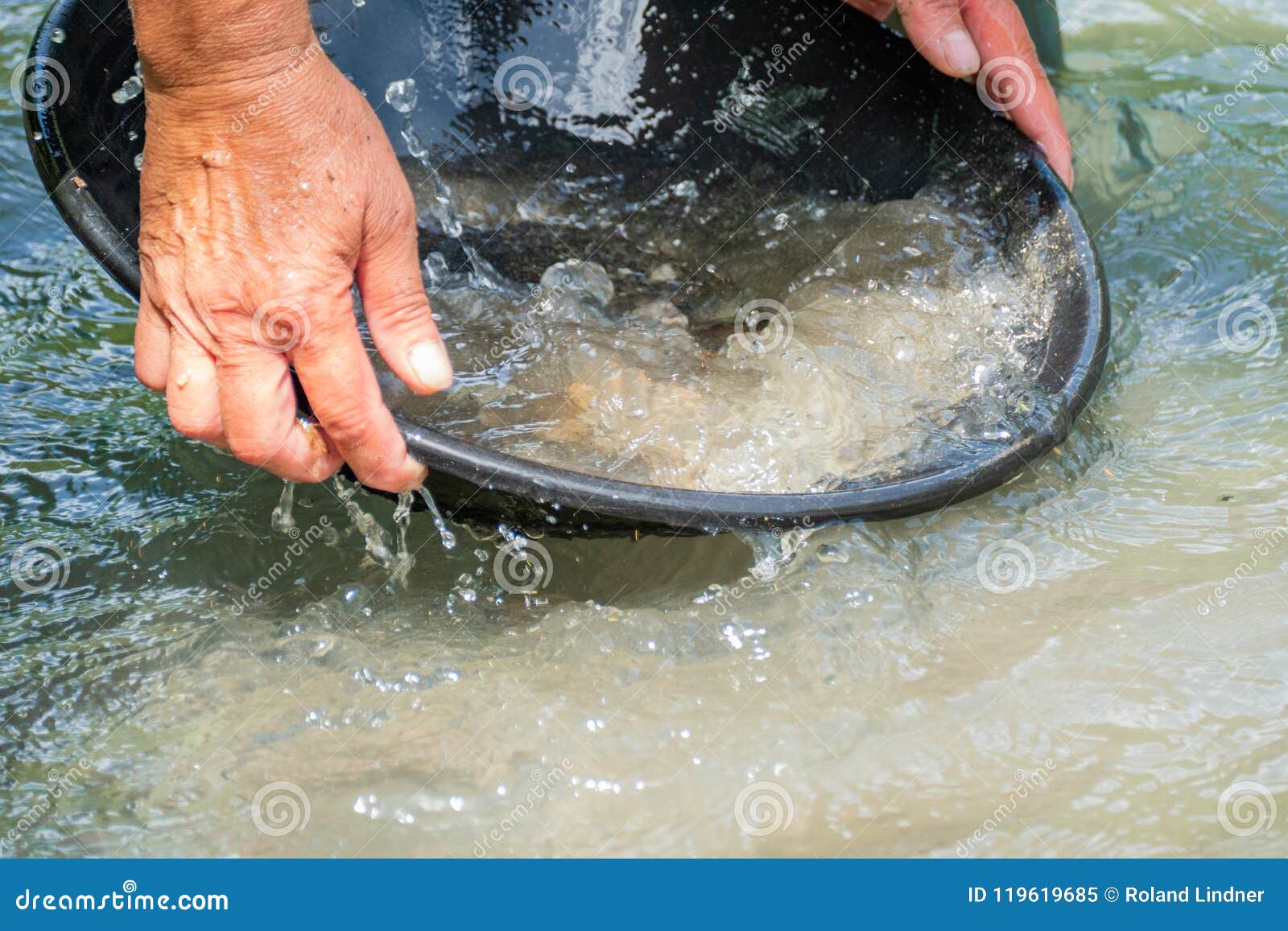 Gold washing in the river stock image. Image of gemstone 119619685