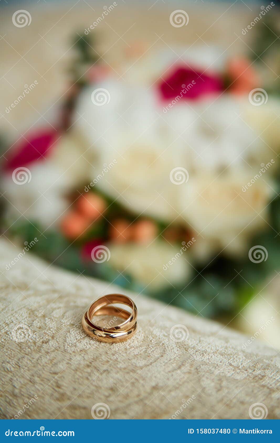 Gold Wedding Rings Close-up on a Beige Background Stock Photo - Image ...