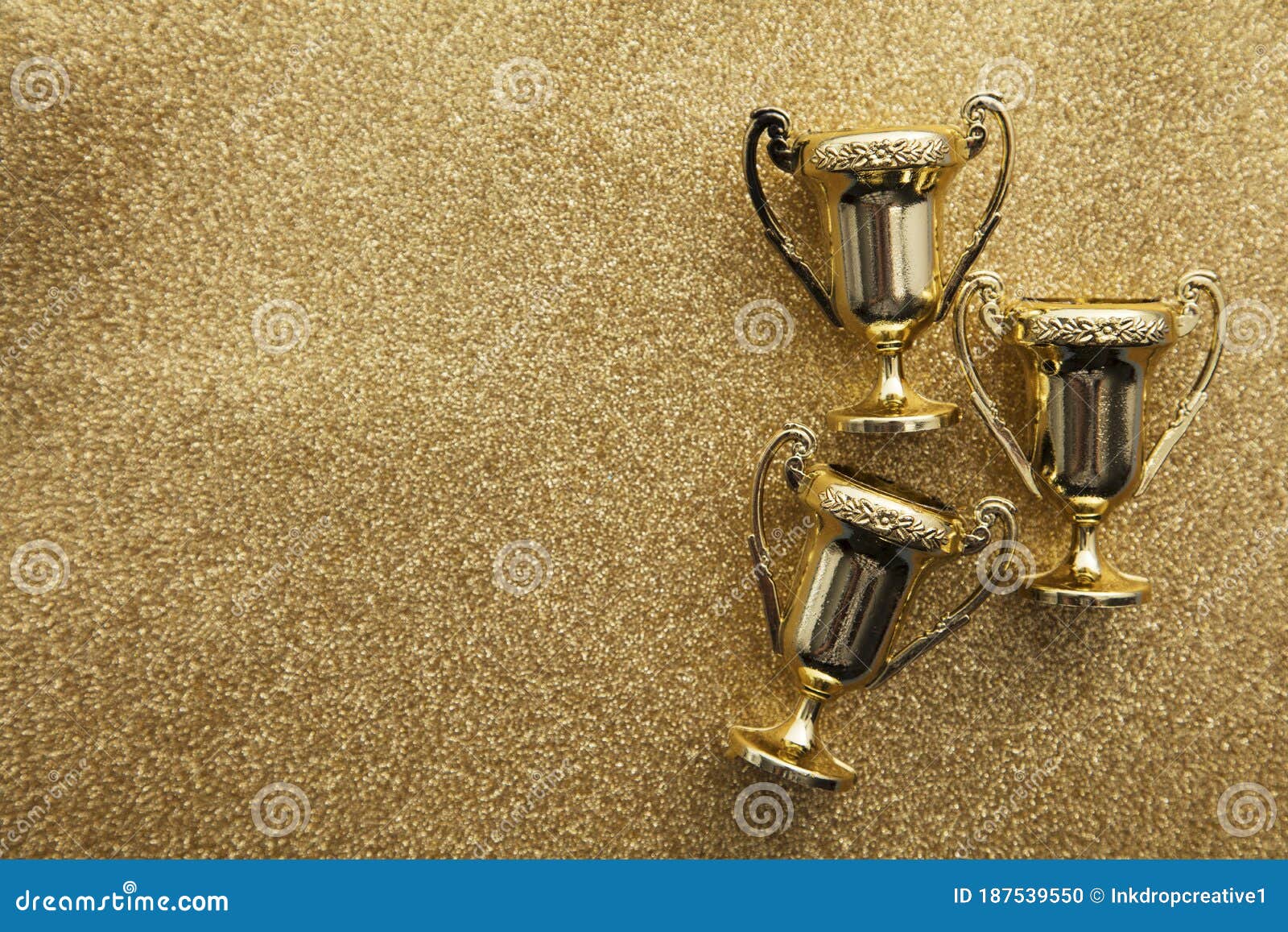 Gold Winners Achievement Trophy on a Gold Glitter Background Stock Photo -  Image of award, background: 187539550