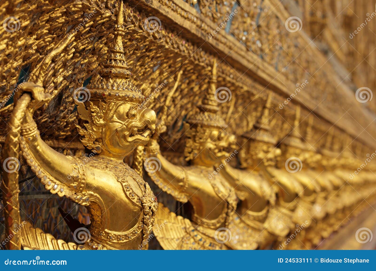 Golden asian statues stock image. Image of aquiline, ornamental 24533111