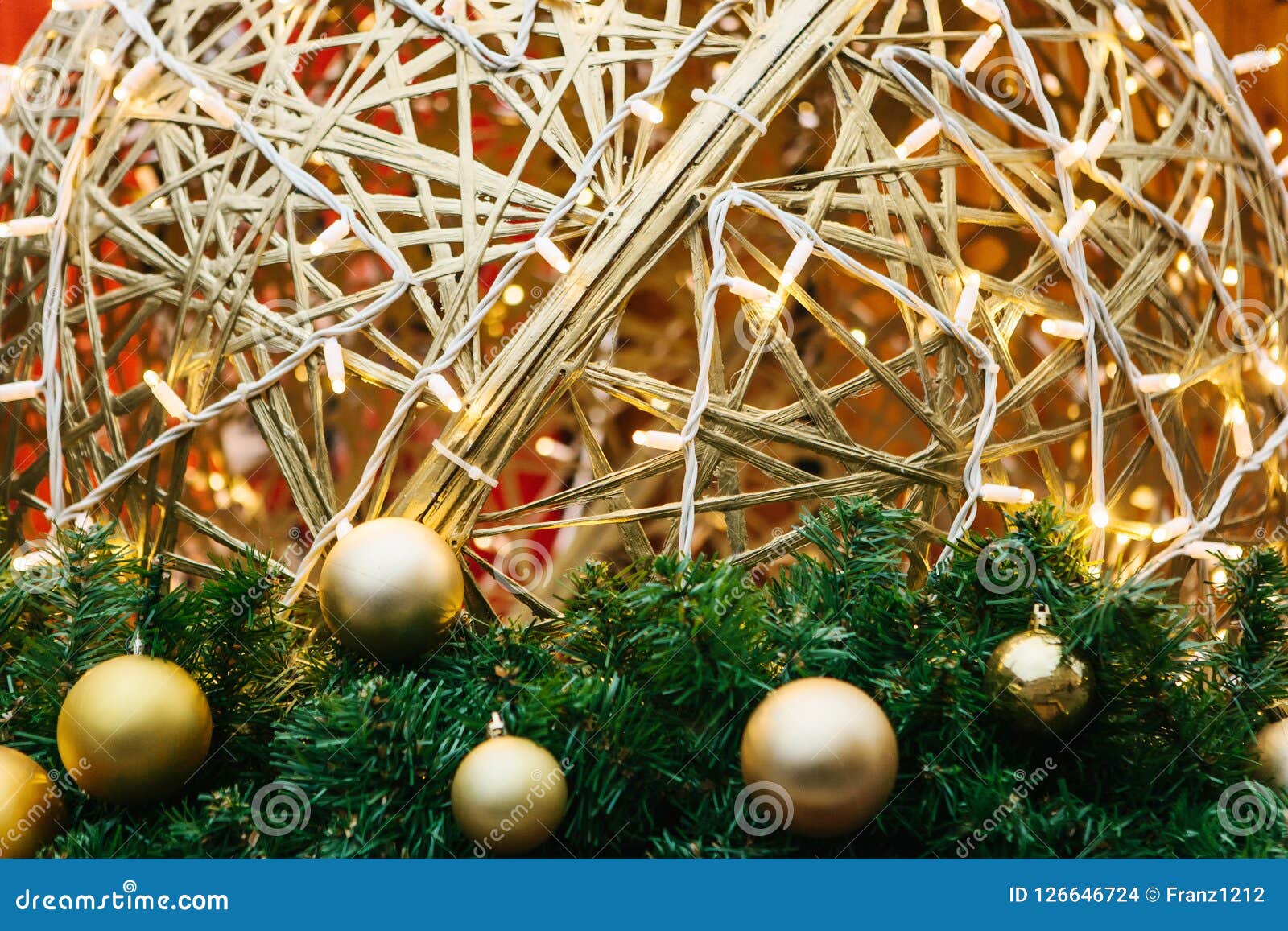 Golden Balls on a Christmas Tree with Garlands. Stock Photo Image of