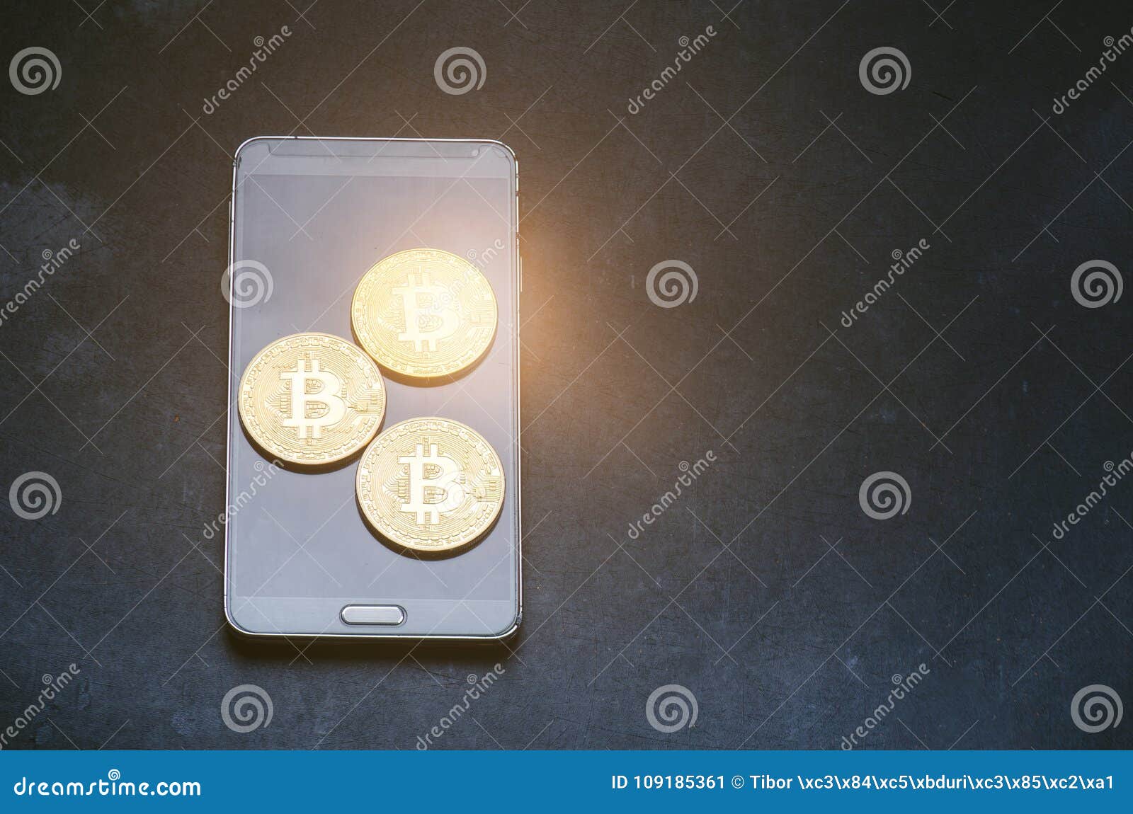 Golden Bitcoin Coins On A Smart Phone. Virtual Currency ...