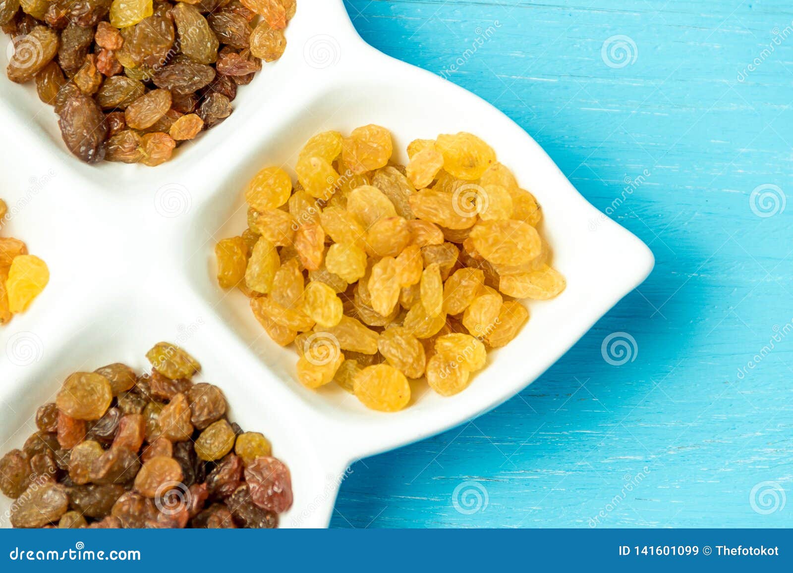 Golden and Brown Raisins on Plate. Top View of Dried Grapes. Stock ...