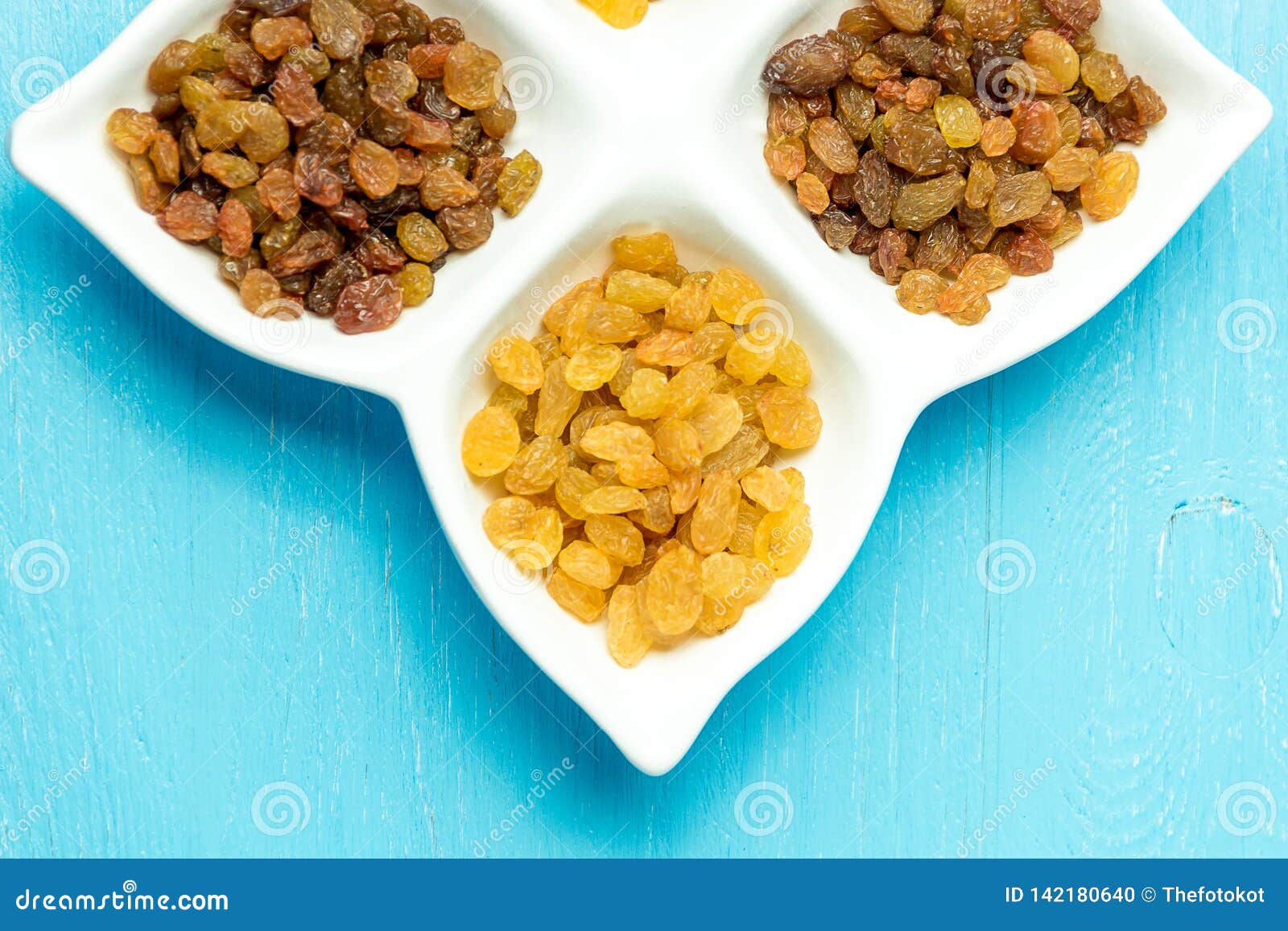 Golden and Brown Raisins on Plate. Top View of Dried Grapes. Stock ...
