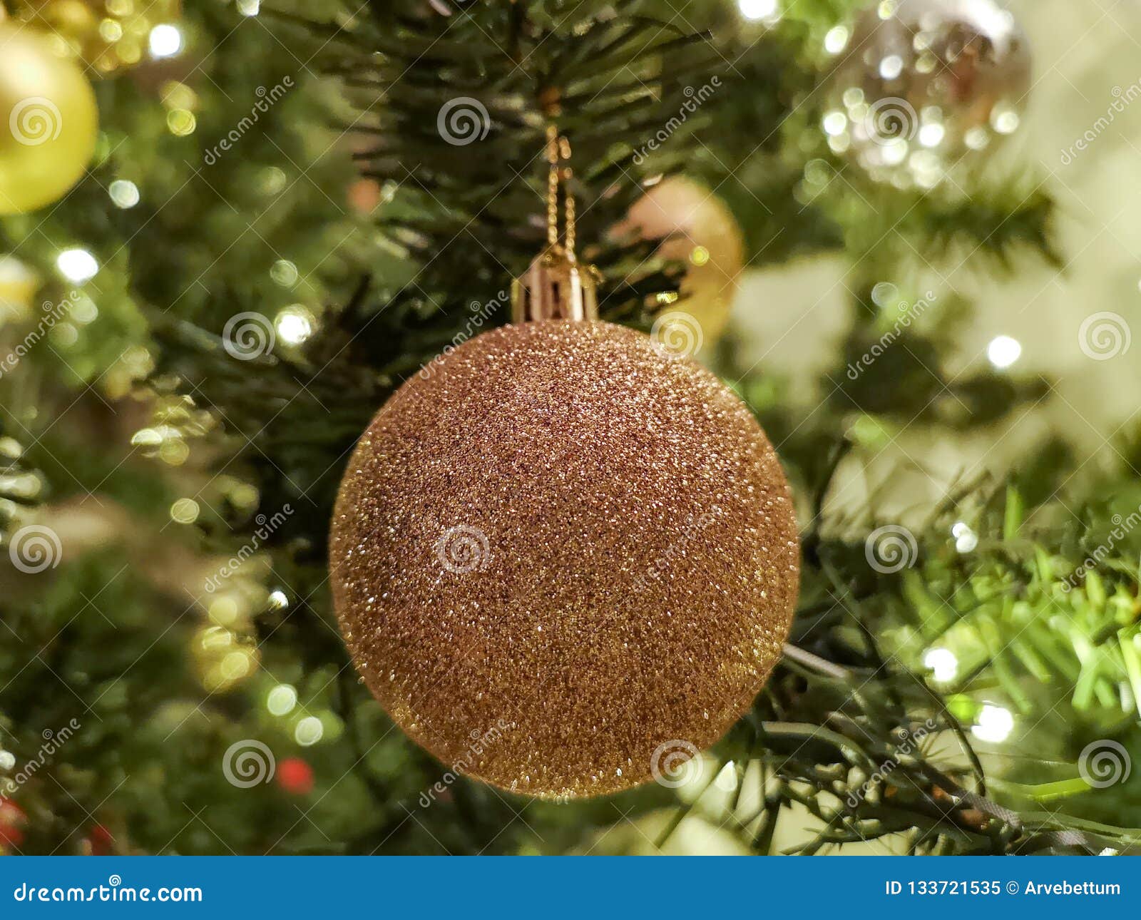 Golden Christmas Bauble on Tree Stock Image - Image of spruce ...