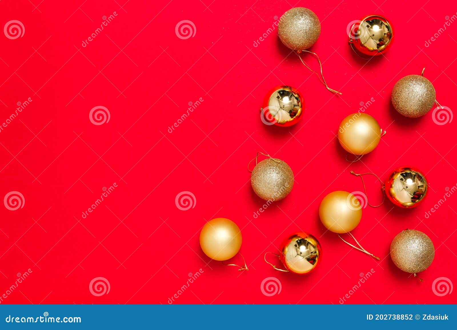 golden christmas tree balls lays on red background. preparing for the christmas holidays. banner for a store selling christmas