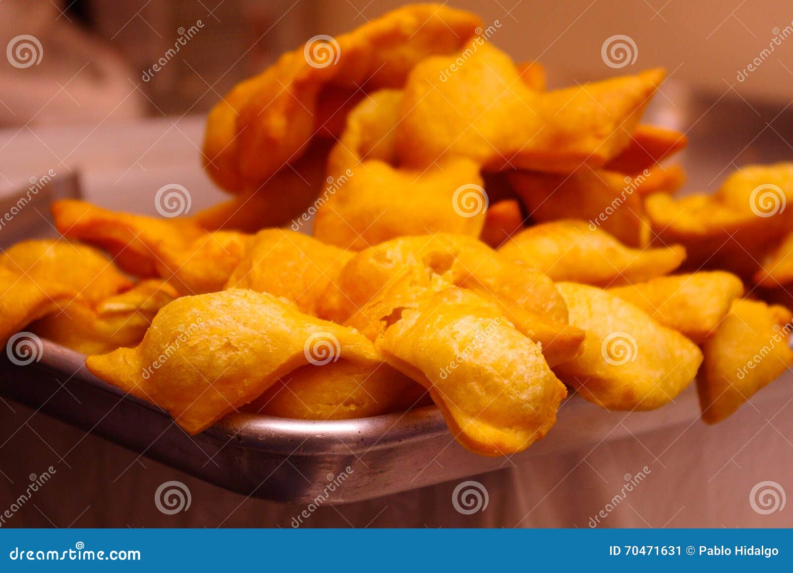 Golden Crispy Doughs, Traditional Dessert in Ecuador Served on a Silver