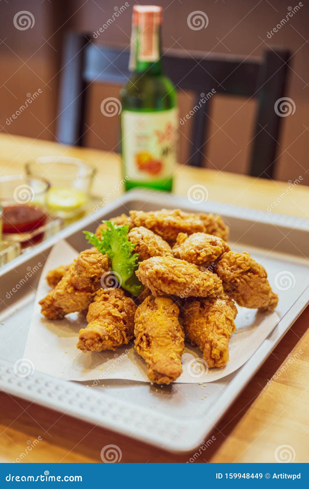 golden crunchy korean fried chicken basic huraideu-chikin served with pickled and soju.
