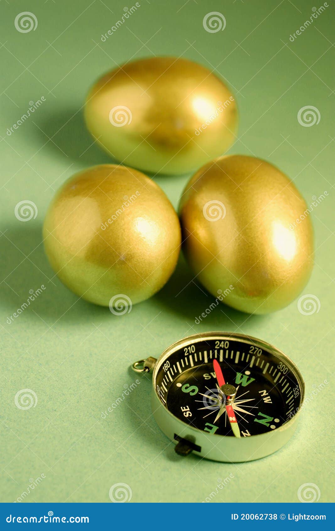 Golden Eggs and Compass stock photo. Image of expedition 20062738