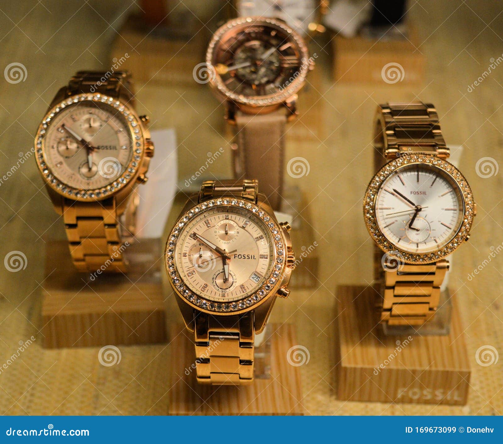 Golden Fossil Watches Displayed in a Store Editorial Stock Image - Image of  zirkonia, wood: 169673099