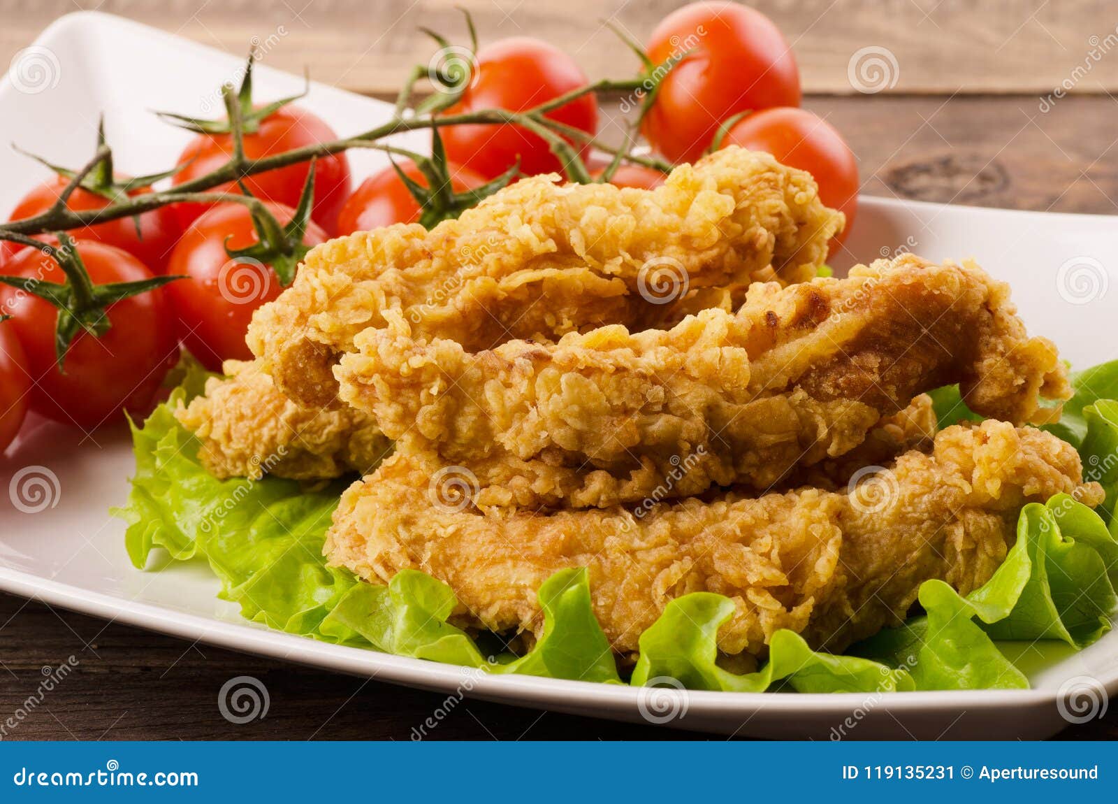 golden fried chicken strips in breading