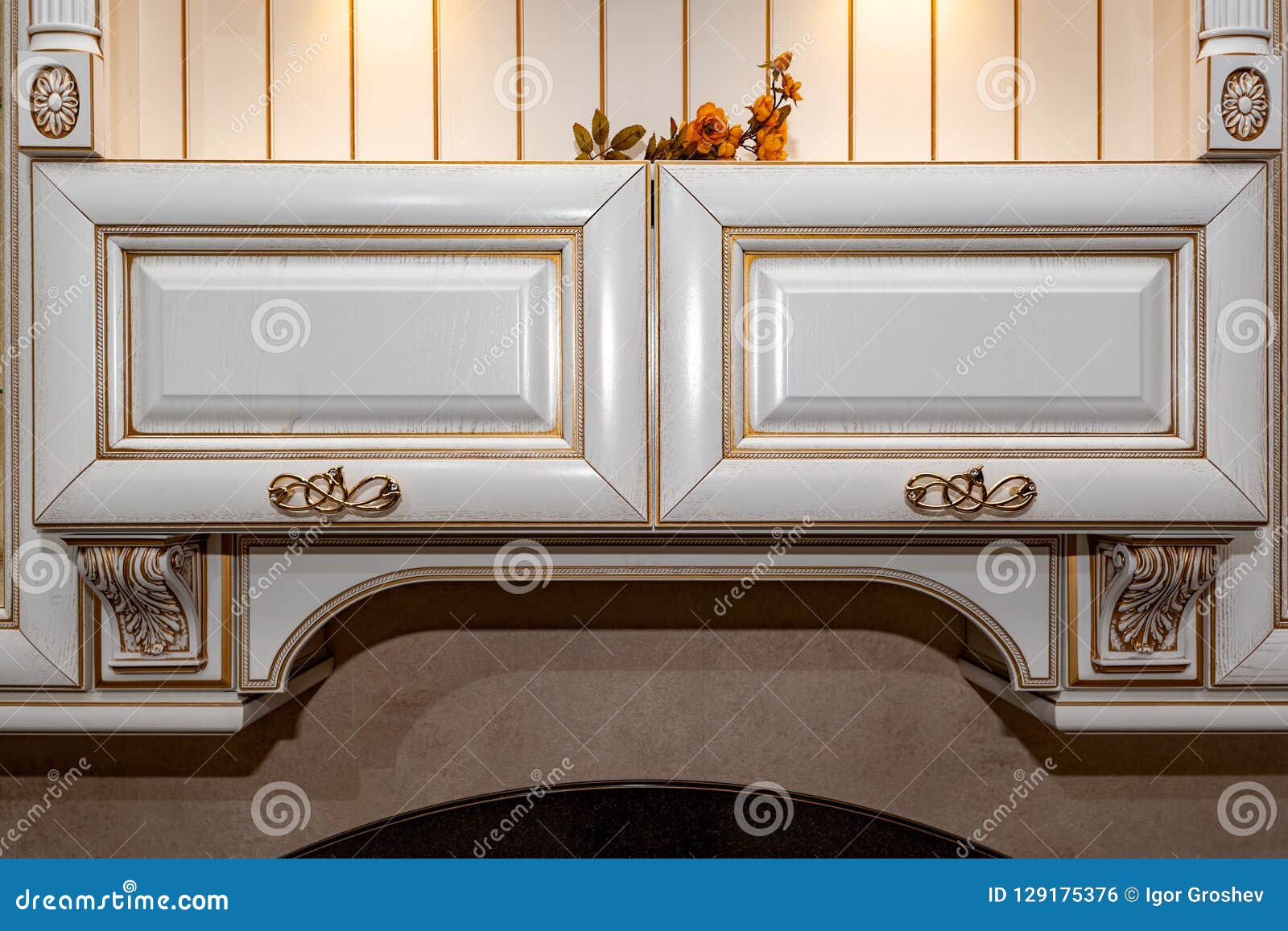 Golden Furniture Handle On White Wooden Dresser Stock Photo