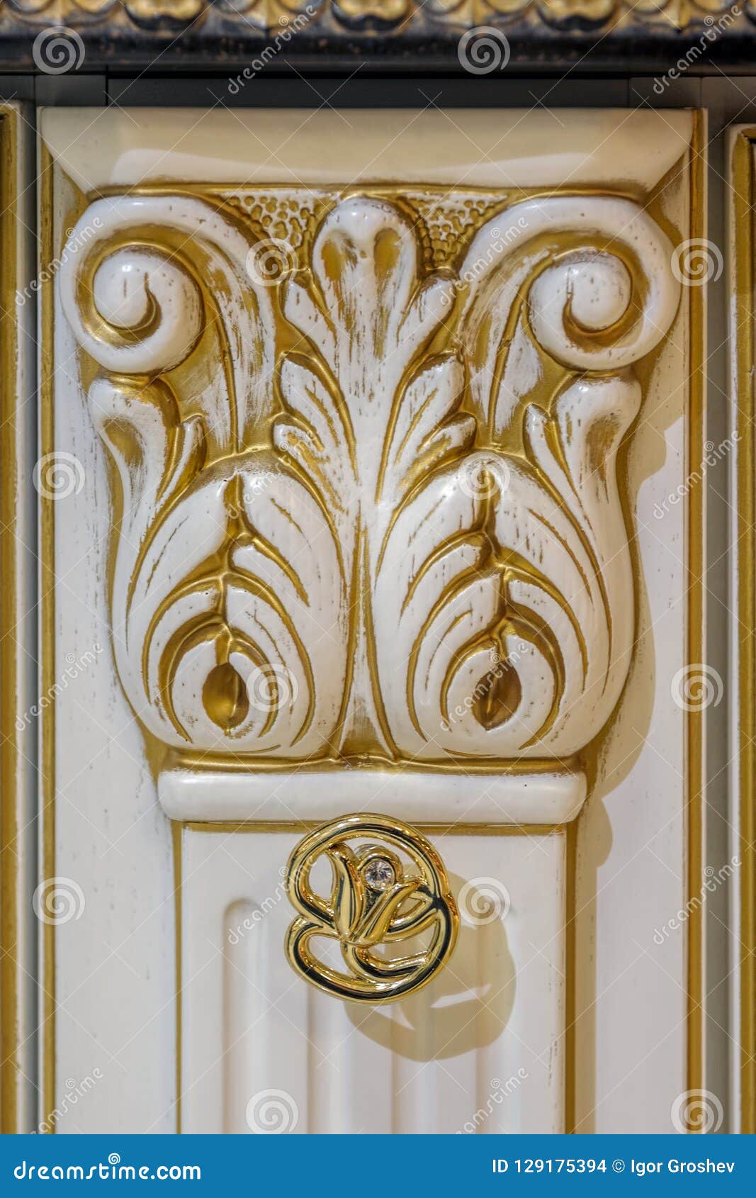 Golden Furniture Handle On White Wooden Dresser Stock Photo