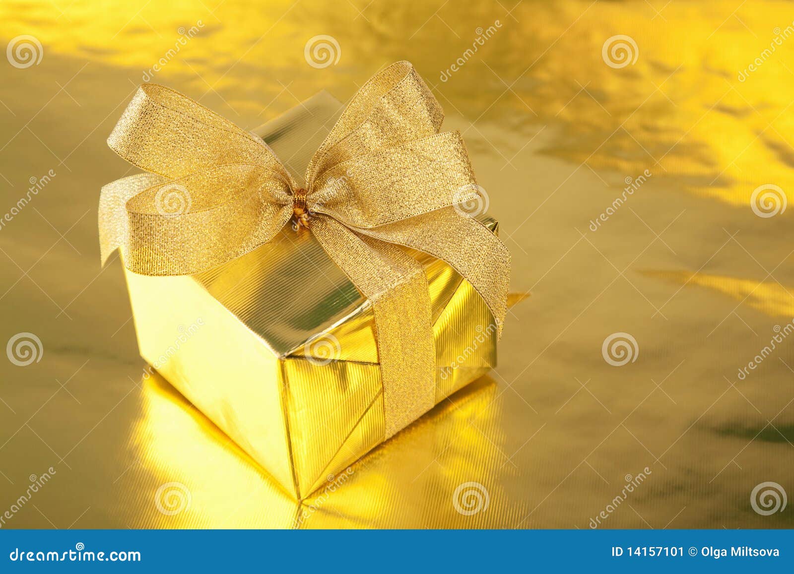 Golden gift box with bow. Golden gift box with yellow bow