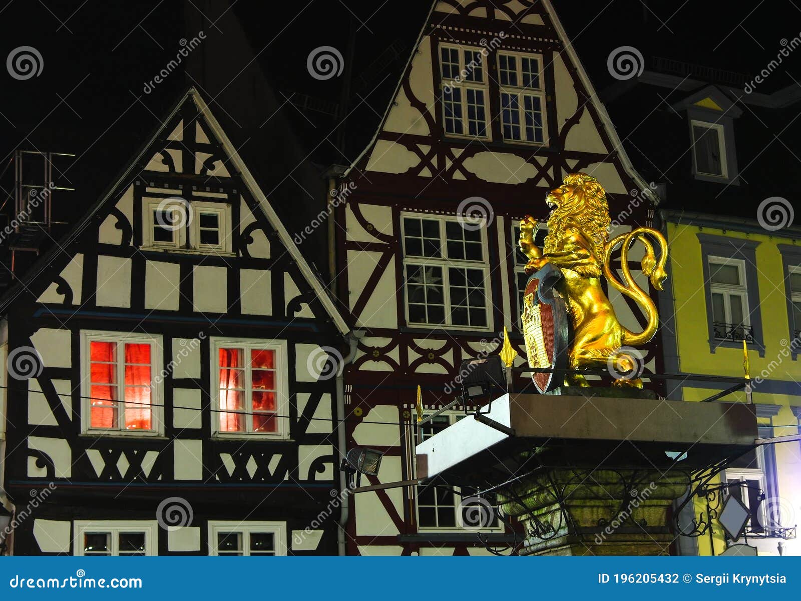 golden hachenburg lion -  of town on old market square of hachenburg, rheinland-pfalz, germany at the night