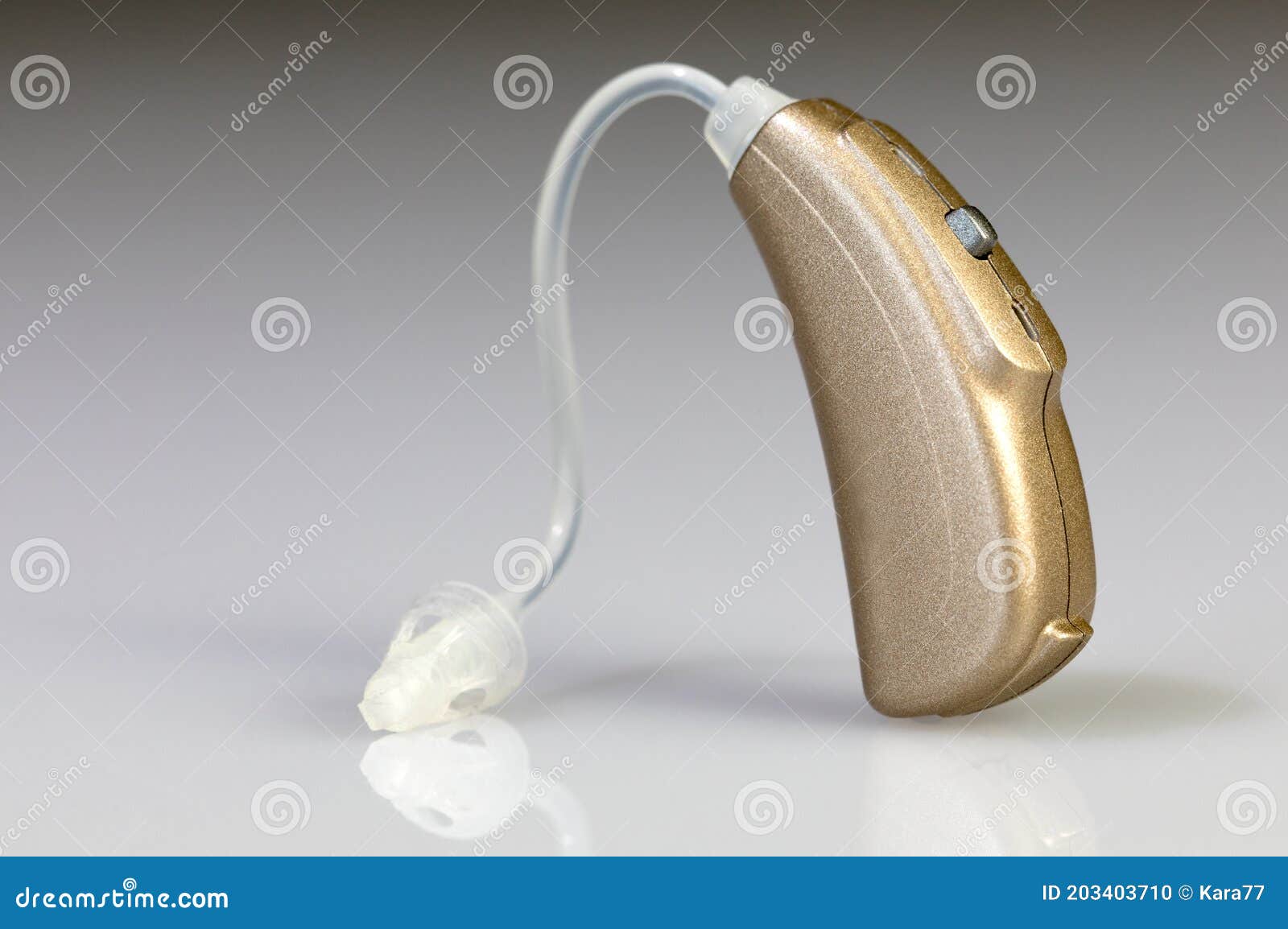 Golden_hearing_aid stock photo. Image of adjust, health 203403710
