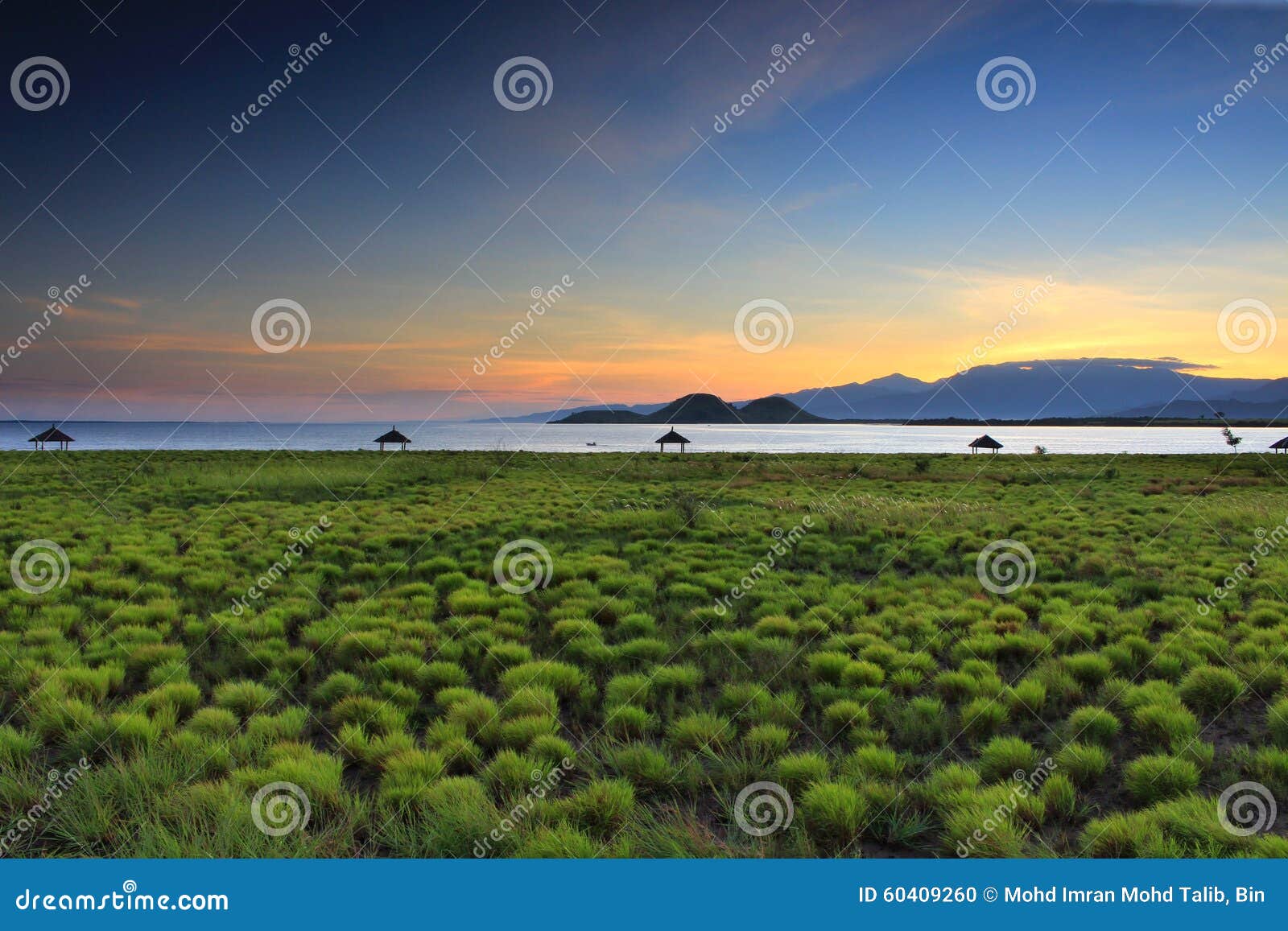 golden light above mount rinjani as seen from kenawa island, sumbawa, indonesia