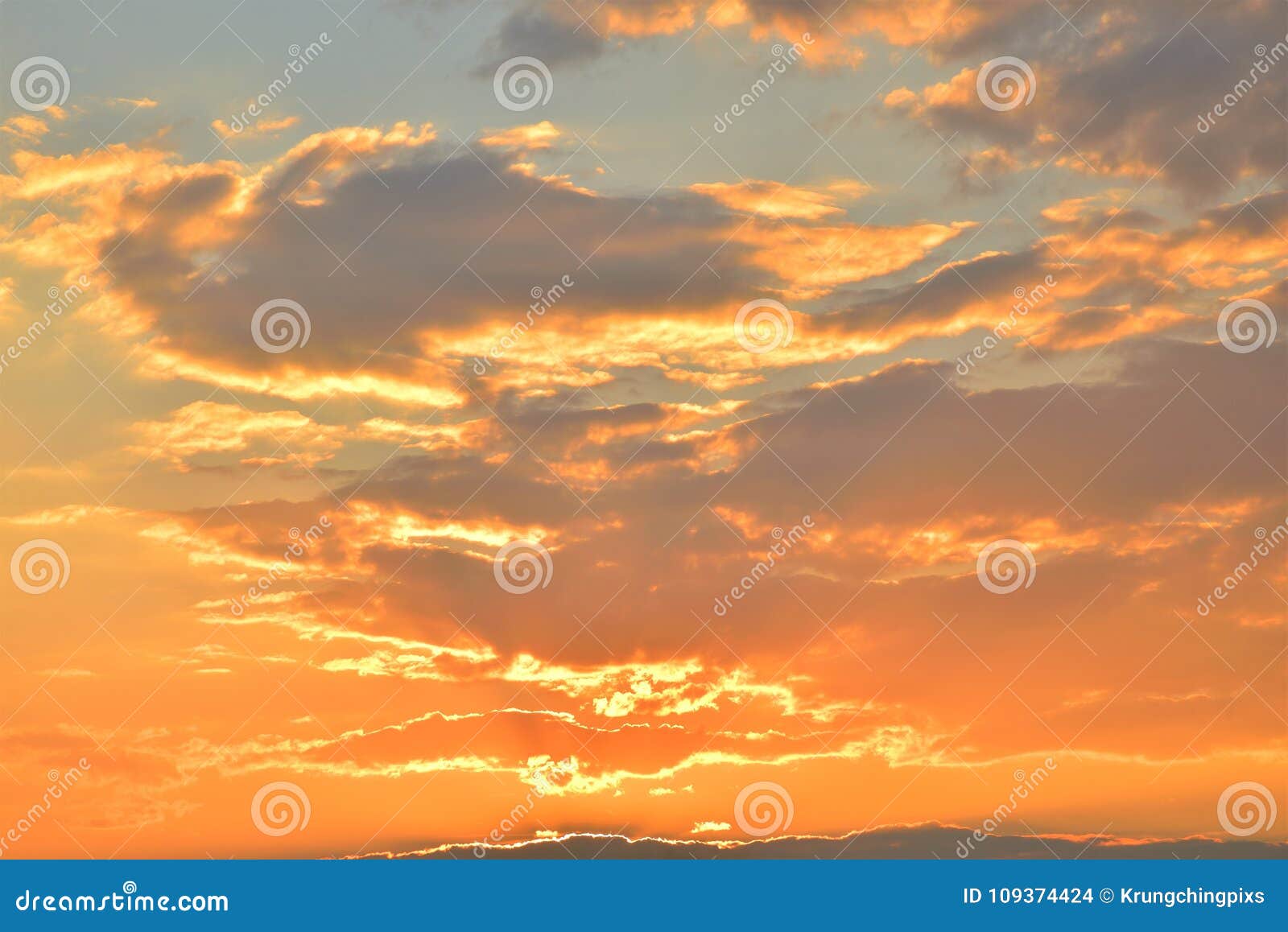 Golden Light on Dark Clouds during Sunset. Stock Photo Image of