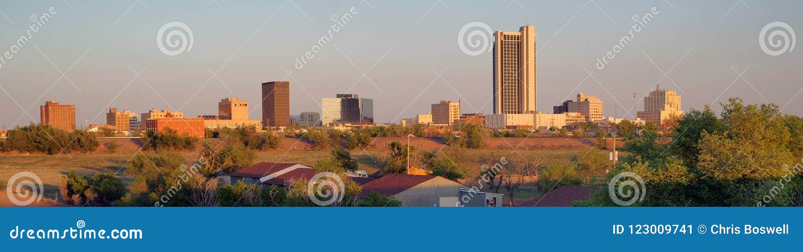 golden light hits the buildings and landscape of amarillo texas